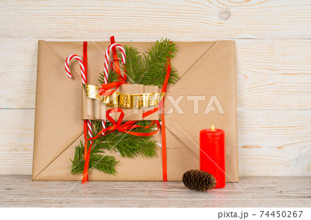 christmas composition with red burning candle and fir cone christmas composition with red burning candle and fir cone 74450267