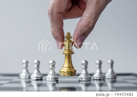 gold Chess King figure Stand out from the crowd on Chessboard background. Strategy, leadership, business, teamwork, different, Unique and Human resource management concept 74455482