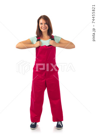 Attractive woman in red overalls, isolated on a white. 74455821