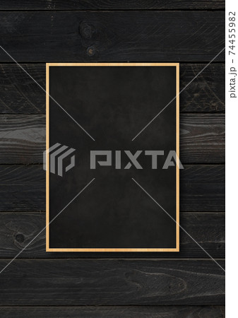Traditional blackboard isolated on a black wood background 74455982