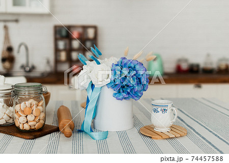 Artificial flowers. Decorative flowers as a gift. Flowers in a round box. 74457588