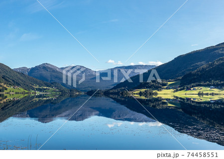 Norway mountain lake mirror on sunny day landscape Norway mountain lake mirror on sunny day landscape 74458551