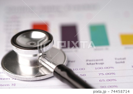 Stethoscope on chart or graph paper, Financial, account, statistics and business data  medical health concept.. 74458714