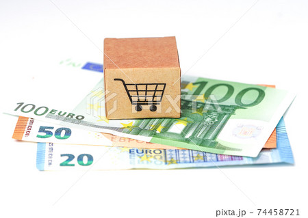 Shopping cart logo on box with Euro banknotes background Shopping cart logo on box with Euro banknotes background 74458721