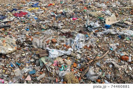 Stack of different types of large garbage dump, plastic bags, and trash bins in urban area in Environmental pollution concept. Stack of different types of large garbage dump, plastic bags, and trash bins in urban area in Environmental pollution concept. 74460881