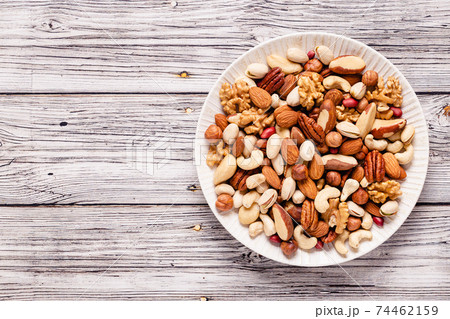 Various nuts on a plate Various nuts on a plate 74462159