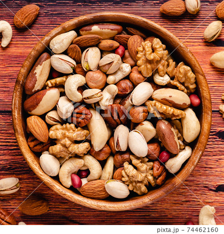 Various Nuts in wooden bowl Various Nuts in wooden bowl 74462160
