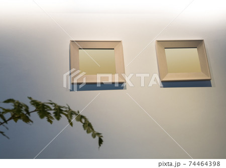 The blank wooden picture frame on the wall 74464398