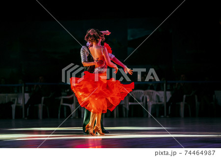 couple dancers dancing in dark gym 74464987