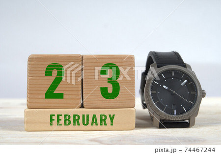 23 february calendar date on wooden blocks with wrist watch 23 february calendar date on wooden blocks with wrist watch 74467244
