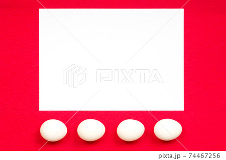 easter concept, white paper and eggs on red background 74467256
