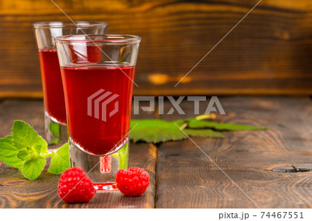 fresh homemade raspberry juice in high glass 74467551