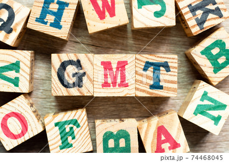 Alphabet letter block in word GMT (abbreviation of Greenwich Mean Time) with another on wood background Alphabet letter block in word GMT (abbreviation of Greenwich Mean Time) with another on wood background 74468045