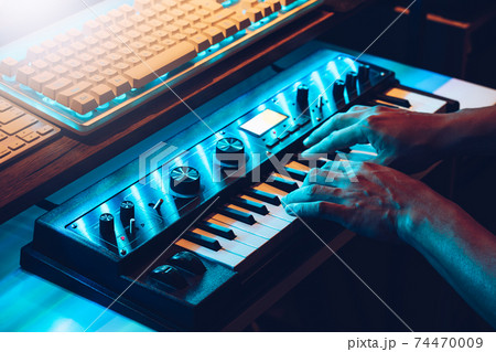 male musician hands playing on synthesizer keys. music concept male musician hands playing on synthesizer keys. music concept 74470009