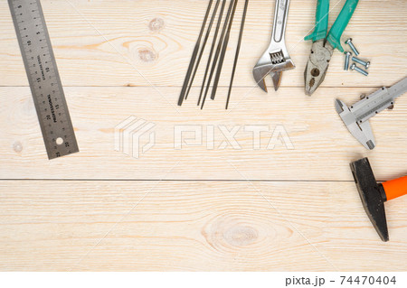 hand tools on wooden planks 74470404