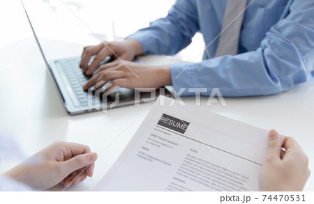 Employer or selection committee is reading the candidate's resume and competence background, Job interview by HR, History exam and work ability, Employment and Recruitment Concept. Employer or selection committee is reading the candidate's resume and competence background, Job interview by HR, History exam and work ability, Employment and Recruitment Concept. 74470531