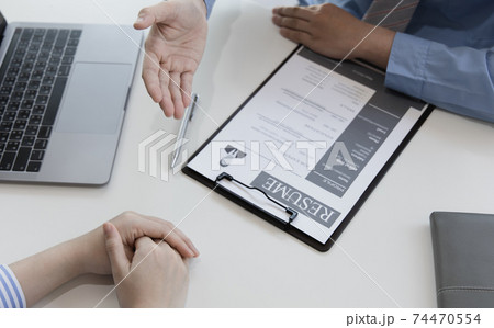 Employer or HR leader is interviewing participants, applying for a company employee, and having read the proficiency test resume to recruit qualified employees, Selection of job applicants. 74470554