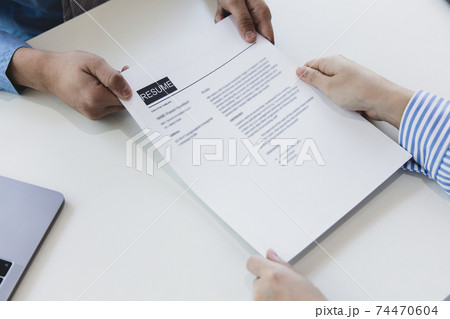 Applicants submitting a resume to the staff to apply for a job, Participating in the selection of applicants to work in the company, Submitting documents or submitting a resume. 74470604