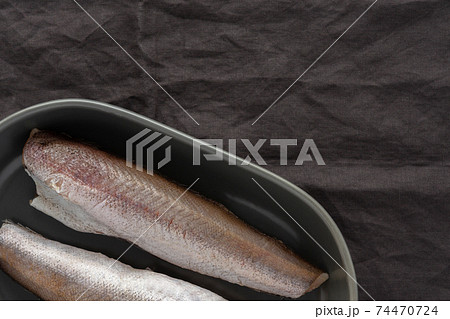 Two raw hake carcasses close-up Two raw hake carcasses close-up 74470724