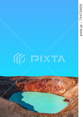 View over Icelandic landscape of colorful volcanic caldera Askja, geothermal Viti crater lake in the middle of volcanic desert in Highlands, with red, turquoise volcano soil and blue sky, Iceland View over Icelandic landscape of colorful volcanic caldera Askja, geothermal Viti crater lake in the middle of volcanic desert in Highlands, with red, turquoise volcano soil and blue sky, Iceland 74470809