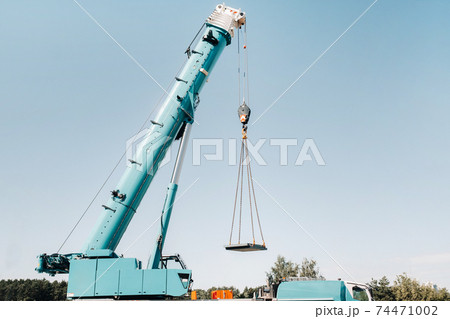 the stove is loaded onto a large blue car crane and prepared for operation . The largest truck crane for solving complex tasks. 74471002
