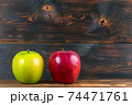 ripe juicy red and green apples on rustic wooden table 74471761