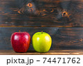 ripe juicy red and green apples on rustic wooden table 74471762