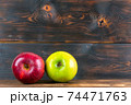 ripe juicy red and green apples on rustic wooden table 74471763