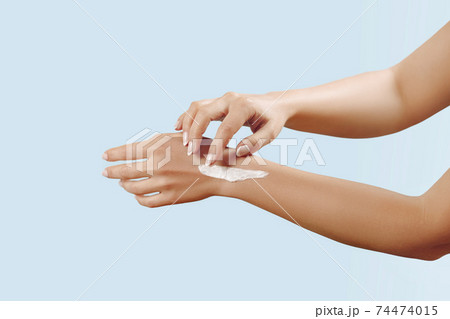 Beautiful Woman Hands. Female Hands Applying Cream, Lotion. Spa and Manicure concept. Soft skin, skincare concept. Hand Skin Care. 74474015