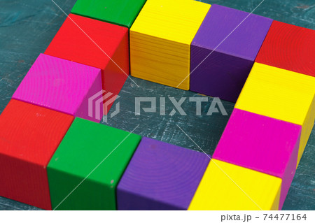 Colorful wooden blocks background, top view. Macro photo. Close up. 74477164