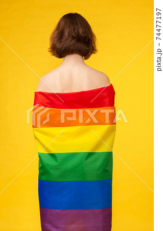 young woman covering with lgbt pride flag young woman covering with lgbt pride flag 74477197