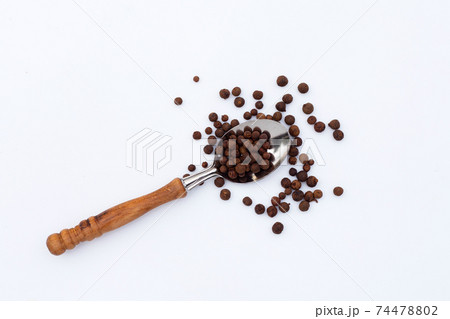 Allspice on white background. Copy space Allspice on white background. Copy space 74478802