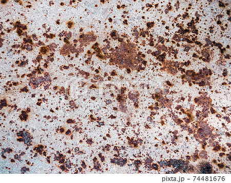 Worn rusty metal surface with cracking texture background. 74481676