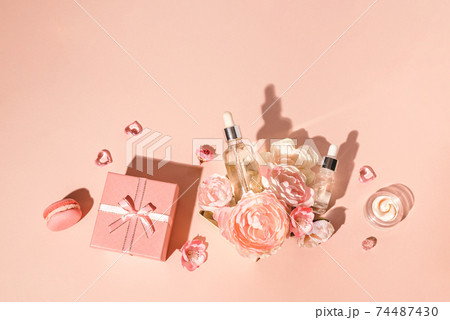 Natural cosmetics, serum and extracts, natural skin care combined with flowers and gifts. Spring gifts concept for womens holiday 74487430