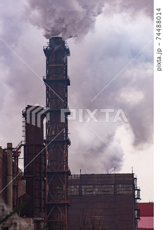 Environmental issues. Air pollution. Smoke emission. vertical photo. Environmental issues. Air pollution. Smoke emission. vertical photo. 74488014