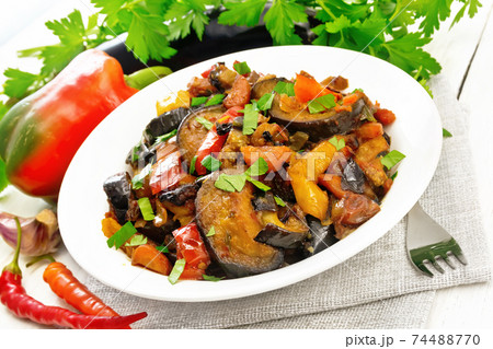Ragout with eggplant and pepper on board Ragout with eggplant and pepper on board 74488770