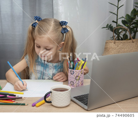 Cute girl doing homework Cute girl doing homework 74490605
