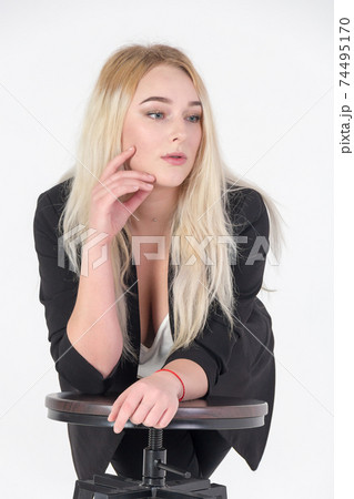 Studio portrait of blonde girl isolated on white background. Studio portrait of blonde girl isolated on white background. 74495170