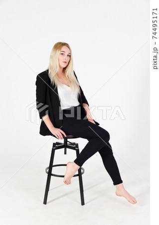 Studio portrait of blonde girl in full growth isolated on white background. 74495171
