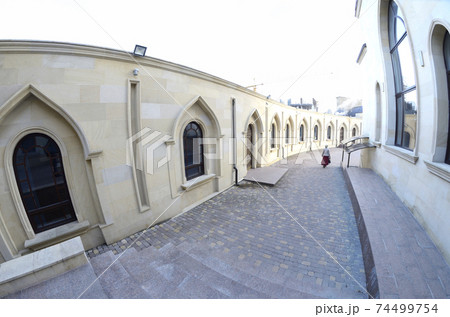 View of courtyard of the Ar-Rahma Mosque (Mercy Mosque) with building of the mosque itself, minaret, and domes 74499754