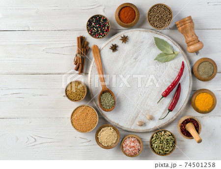 Variety of herbs on white wooden background 74501258
