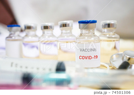 Vaccine and syringe injection. It use for prevention, immunization and treatment from corona virus infection. Vaccine and syringe injection. It use for prevention, immunization and treatment from corona virus infection. 74501306