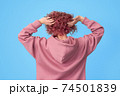 Back of young woman with pink hair 74501839