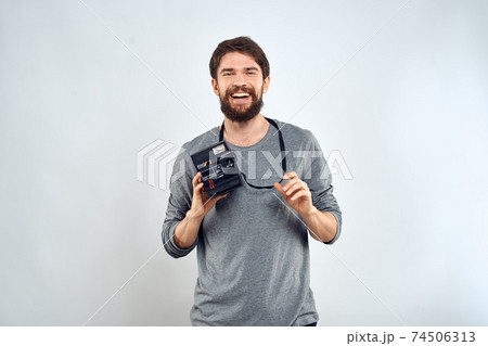 Male photographer professional camera work Studio Technology modern art light background Male photographer professional camera work Studio Technology modern art light background 74506313