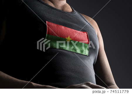 The national flag of Burkina Faso on the athlete's chest The national flag of Burkina Faso on the athlete's chest 74511779