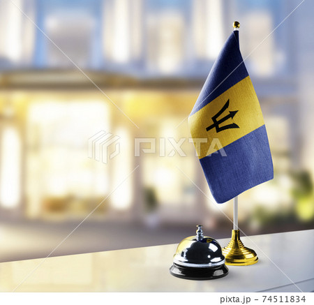 Barbados flag on the reception desk in the lobby of the hotel Barbados flag on the reception desk in the lobby of the hotel 74511834