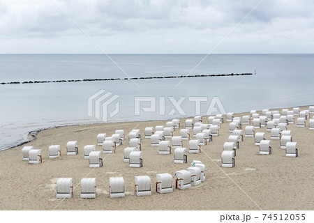 Beach landscape at Baltic Sea on Rugen Island. Beach chairs in Sassnitz Beach landscape at Baltic Sea on Rugen Island. Beach chairs in Sassnitz 74512055