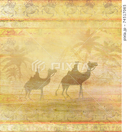 Camel train silhouetted against sky crossing the Sahara Desert - abstract grunge card 74517065