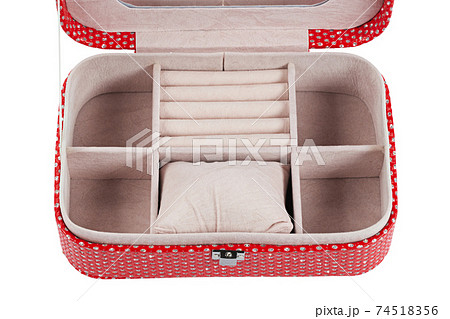 Open red jewelry box adorned with glittering jewels 74518356