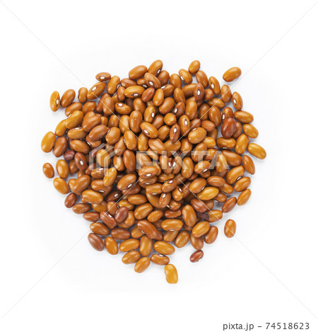 Dried orange beans on a white plate. Dried orange beans on a white plate. 74518623
